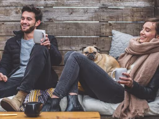 merry christmas, man, woman, dog, pet, pug, owners, couple, relationship, warm clothes, cozy, scarf, jackets, jeans, boots, fashion, people, happy, love, female, young, male, adult, caucasian, happiness, animal, romantic, portrait, smile, smiling, girlfriend, date, boyfriend, together, person, lovers, sitting, relaxing, rustic, cushions, couch, laughing, enjoying, coffee